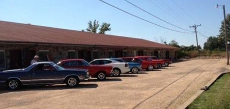 Exterior of motel with cars
